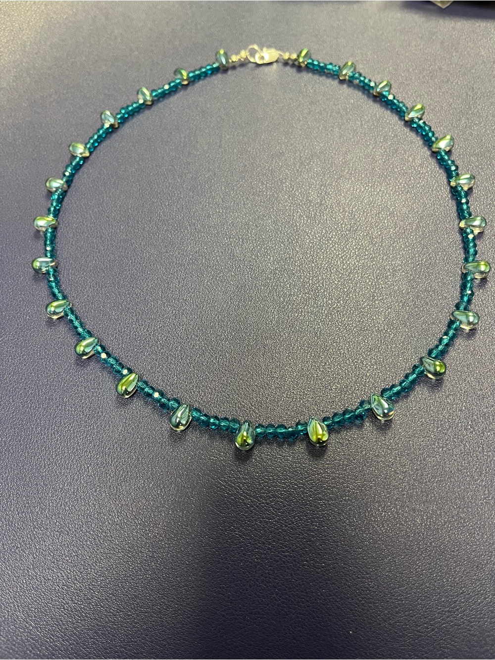 Hand made capri blue and iridescent tear drop bead necklace.